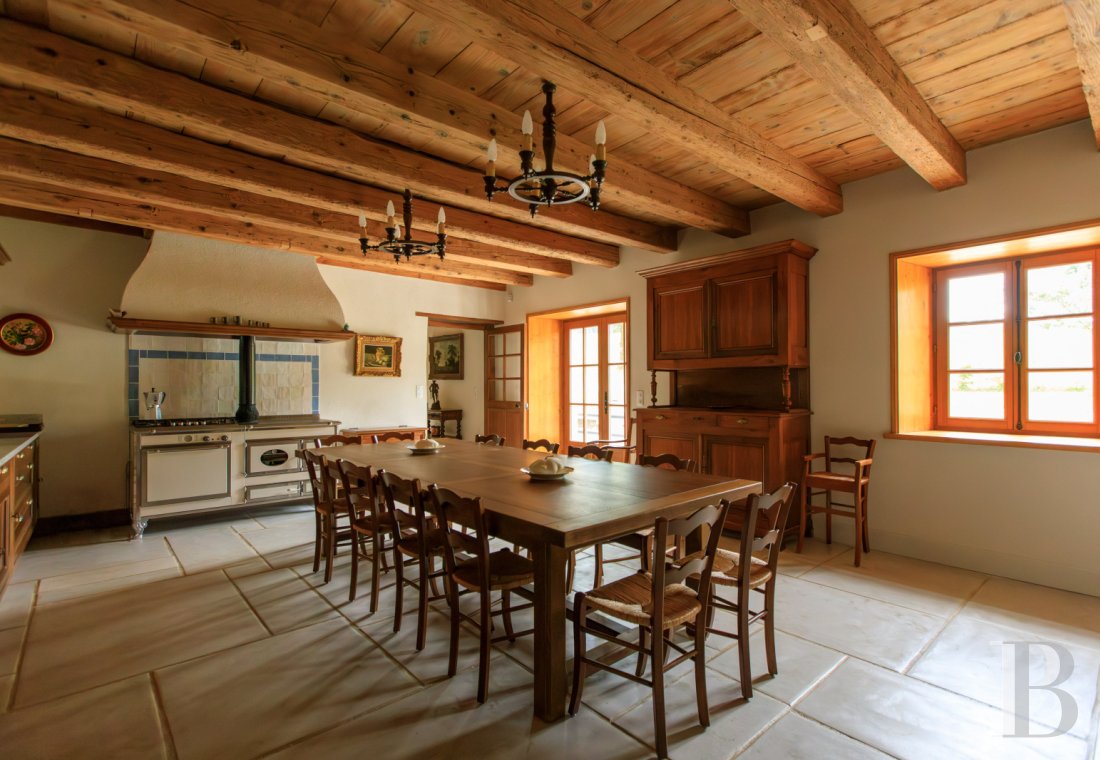 A former livestock farm which has been transformed into a vast, comfortable home near to Nantua in the Haut-Bugey region - photo  n°12